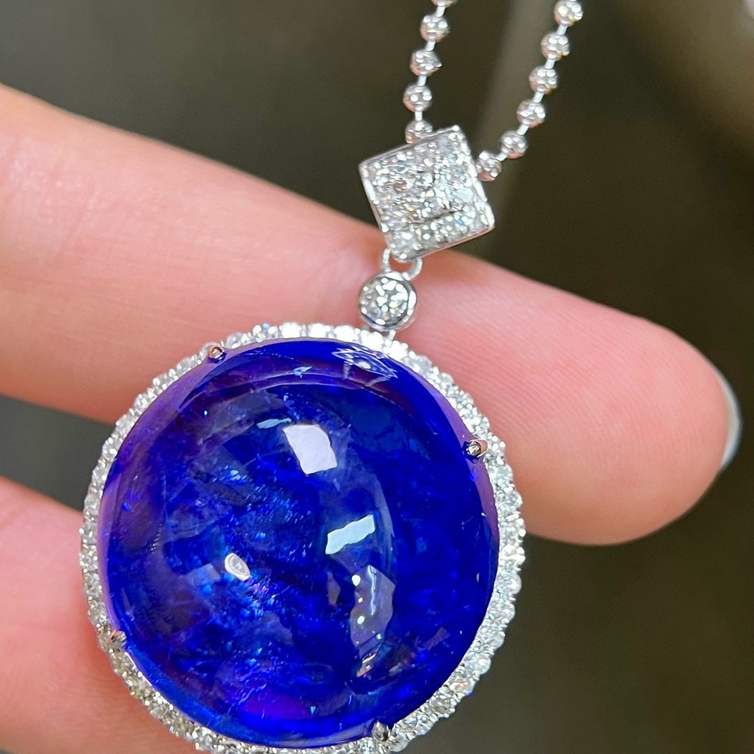 14k Gold 50.76 Ctw Natural Tanzanite & Diamond Pendant( Without Chain ): Ref:231061058 // gold content:14k gold // main gemstone:tanzanite // shape:round // carat weight:50. 08ct // color:blue // treatment:natural // // adjacent gemstone 2 : diamond // shape:round //