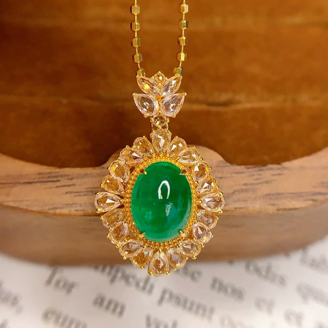 14k Gold 1.8 Ct Natural Emerald & Sapphire Pendant( Without Chain ): Ref:231061105 // gold content:14k gold // main gemstone:emerald // shape:oval // carat weight:1. 8ct // color:green // treatment:natural // // adjacent gemstone 2 : sapphire // number of stones:26 //