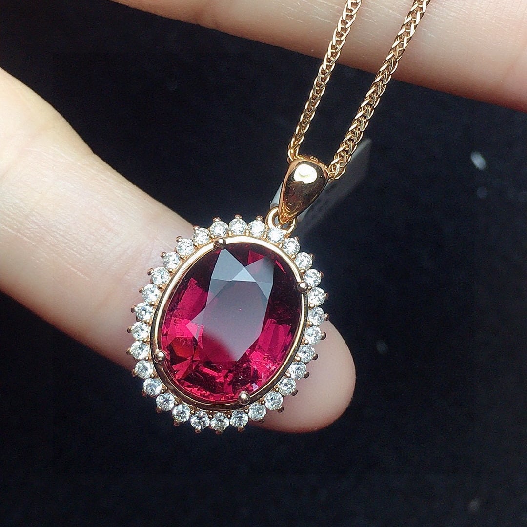 14k Gold 4.43 Ct Natural Tourmaline & Diamond Pendant( Without Chain ): Ref:231061137 // gold content:14k gold // main gemstone:tourmaline // shape:oval // carat weight:4. 43ct // color:red // treatment:natural // // adjacent gemstone 2 : diamond // number of stones:30