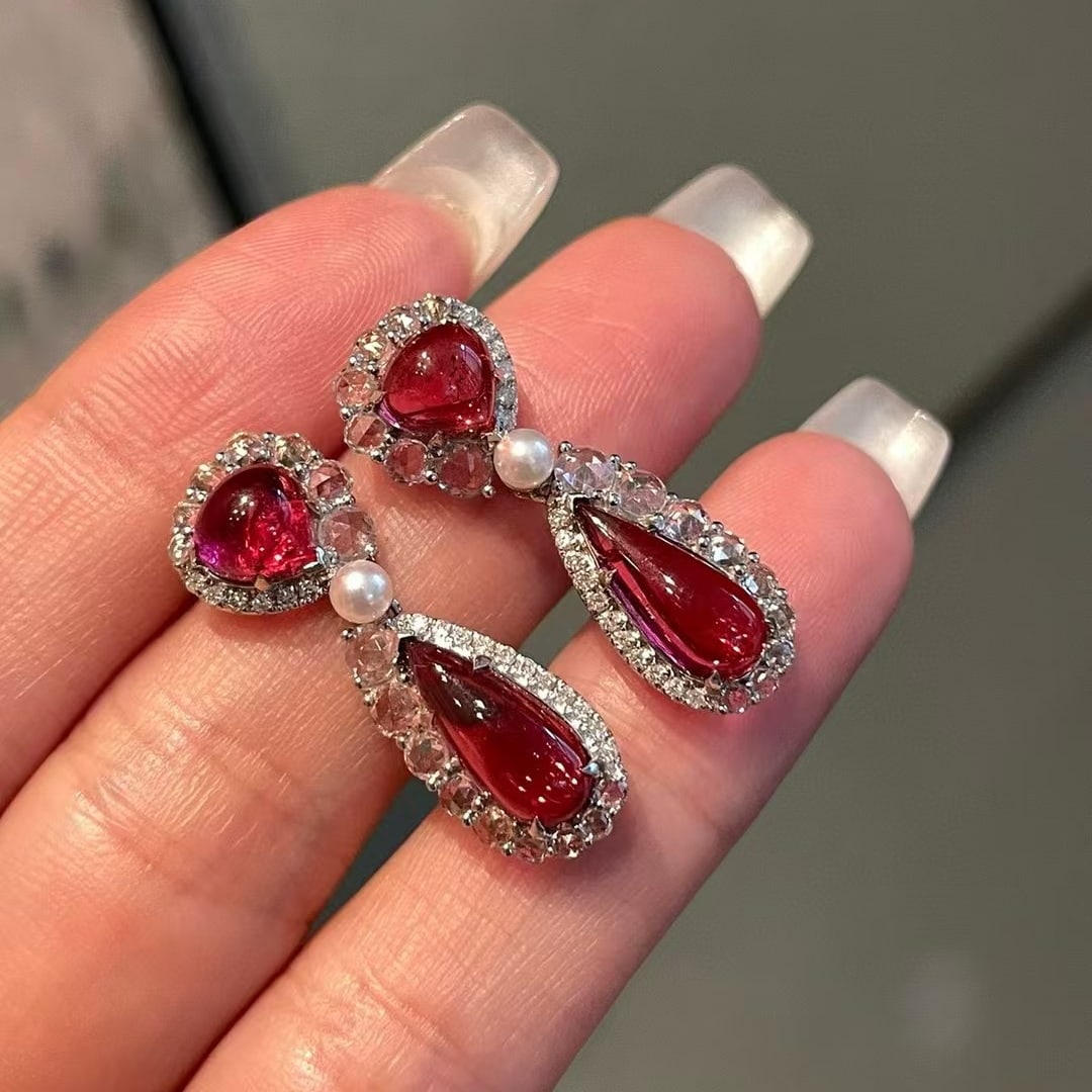 14k Gold 4.6 Ct Natural Tourmaline & Diamond & Sapphire Earrings: Ref:231061217 // gold content:14k gold // main gemstone:tourmaline // number of stones:4 // shape:pear // carat weight:4. 6ct // color:red // treatment:natural // // adjacent gemstone 2 : diamond // s