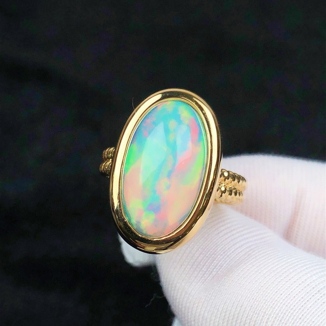 14k Gold 4.36 Ct Natural Opal & Solitaire Ring: Ref:231061243 // gold content:14k gold // ring size:7. 25 us // // main gemstone:opal // shape:oval // carat weight:4. 36ct // color:color // treatment:natural // Condition: NewLow Estimate: