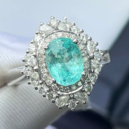 14k Gold 1.6 Ct Natural Paraiba Tourmaline & Diamond Ring: Ref:231062119 // gold content:14k gold // ring size:7. 25us // // main gemstone:paraiba tourmaline // shape:oval // carat weight:1. 6ct // color:blue // treatment:natural // // adjacent gemstone 2