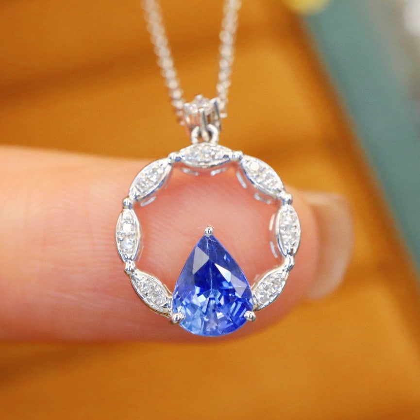 14k Gold 0.88 Ctw Natural Sapphire & Diamond Necklace: Ref:231062143 // gold content:14k gold // main gemstone:sapphire // shape:pear // carat weight:0. 82ct // color:blue // treatment:natural // // adjacent gemstone 2 : diamond // number of stones:15