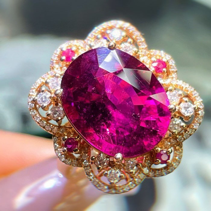 14k Gold 8.75 Ct Natural Tourmaline & Diamond Ring: Ref:231062180 // gold content:14k gold // ring size:7. 25us // // main gemstone:tourmaline // shape:oval // carat weight:8. 75ct // color:red // treatment:natural // // adjacent gemstone 2 : diamond /