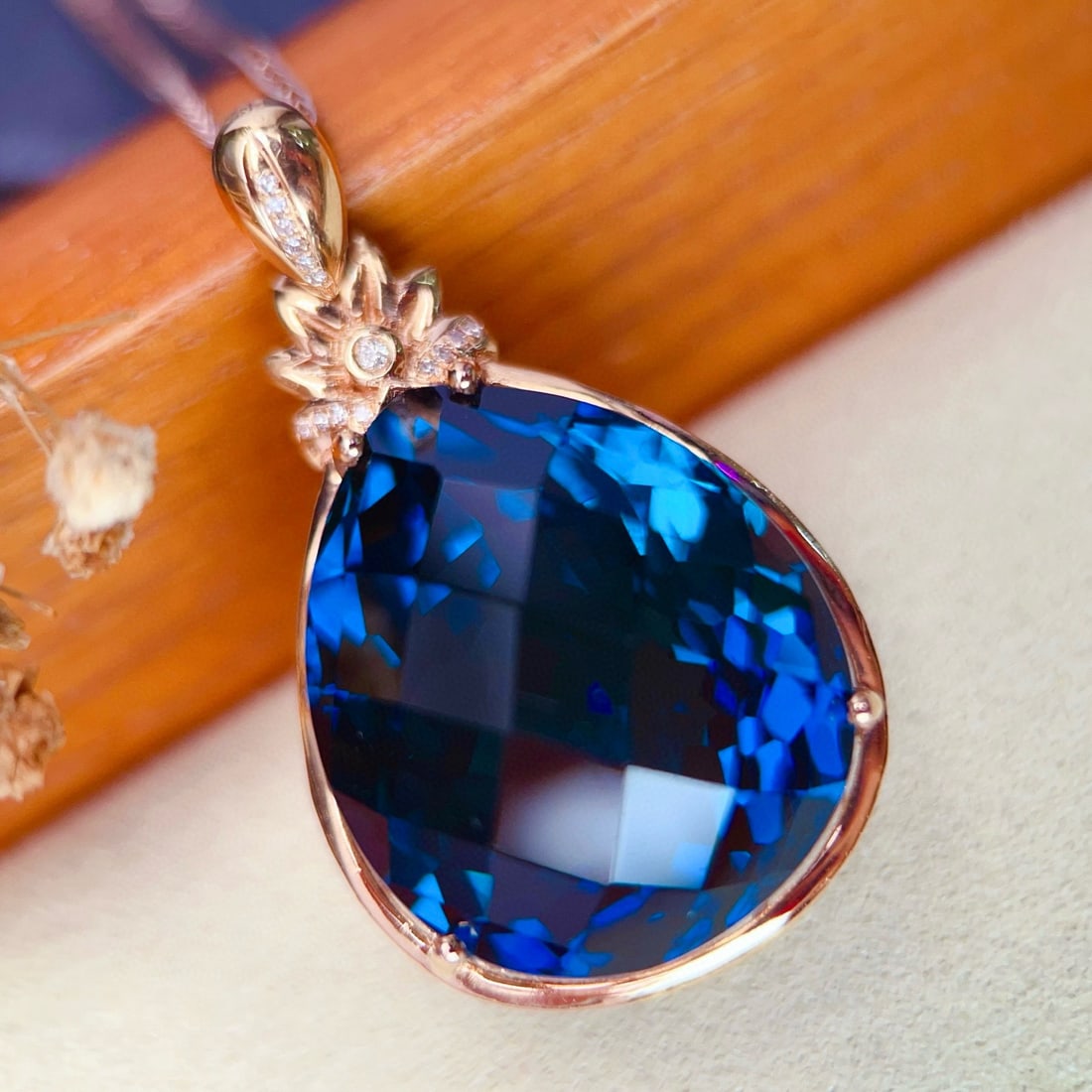 14k Gold 52.7 Ct Natural Topaz & Diamond Pendant( Without Chain ): Ref:231062276 // gold content:14k gold // main gemstone:topaz // shape:pear // carat weight:52. 7ct // color:blue // treatment:natural // // adjacent gemstone 2 : diamond // number of stones:15 //