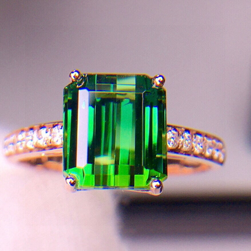 14k Gold 4.5 Ct Natural Tourmaline & Diamond Ring: Ref:231062278 // gold content:14k gold // ring size:7. 25us // // main gemstone:tourmaline // shape:octagonal // carat weight:4. 5ct // color:green // treatment:natural // // adjacent gemstone 2 :