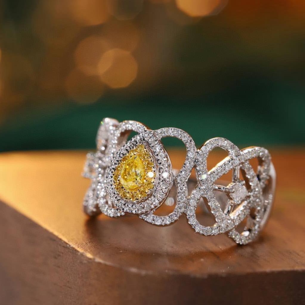 14k Gold 0.55 Ctw Natural Yellow Diamond & Diamond Ring: Ref:231191012 // gold content:14k gold // ring size:7. 25us // // main gemstone:yellow diamond // shape:pear // carat weight:0. 1ct // color:yellow // treatment:natural // // adjacent gemstone 2 : dia