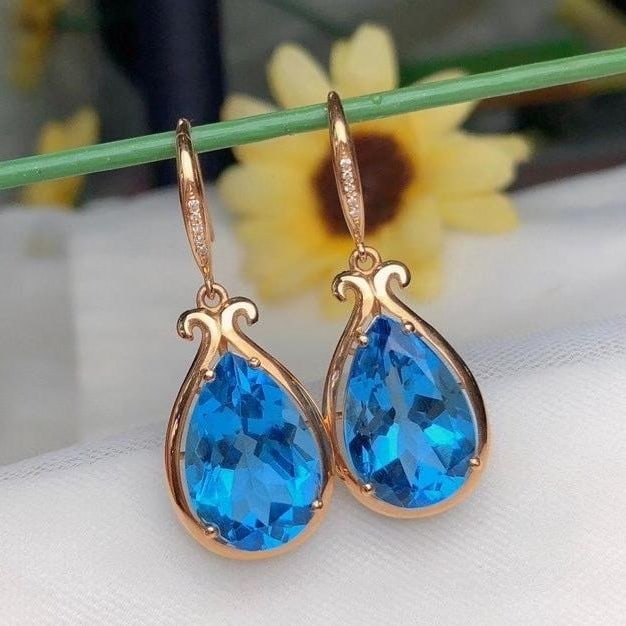 14k Gold 13.88 Ct Natural Topaz & Diamond Earrings: Ref:231191055 // gold content:14k gold // main gemstone:topaz // shape:pear // carat weight:13. 88ct // color:blue // treatment:natural // // adjacent gemstone 2 : diamond // number of stones:10 // sh