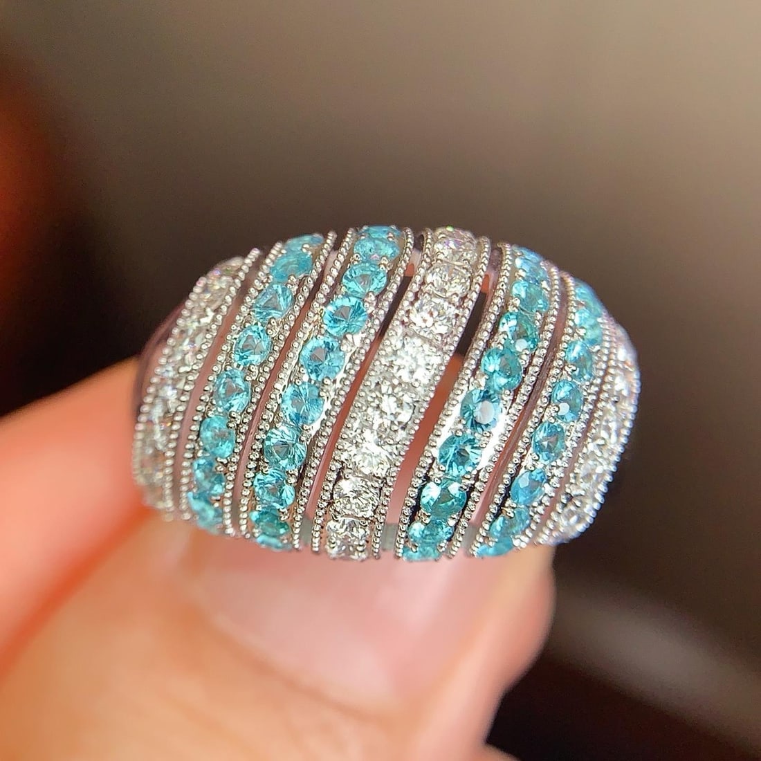 14k Gold 1.21 Ctw Natural Paraiba Tourmaline & Diamond Ring: Ref:231191059 // gold content:14k gold // ring size:7. 25us // // main gemstone:paraiba tourmaline // shape:round // carat weight:0. 7ct // color:blue // treatment:natural // cut grade:g // // adjacen