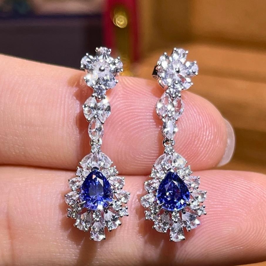 14k Gold 1.72 Ctw Natural Sapphire & Diamond Earrings: Ref:231191084 // gold content:14k gold // main gemstone:sapphire // shape:pear // carat weight:1. 58ct // color:blue // treatment:natural // // adjacent gemstone 2 : diamond // number of stones:20 // 