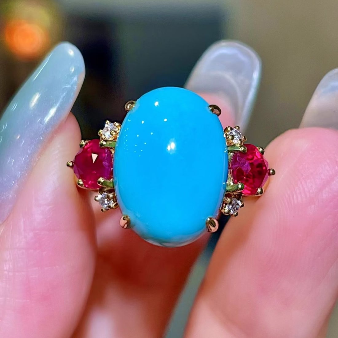14k Gold 7.85 Ctw Natural Blue Turquoise & Ruby Ring: Ref:231191111 // gold content:14k gold // ring size:7. 25us // // main gemstone:blue turquoise // shape:oval // carat weight:6. 83ct // color:blue // treatment:natural // // adjacent gemstone 2 : ruby