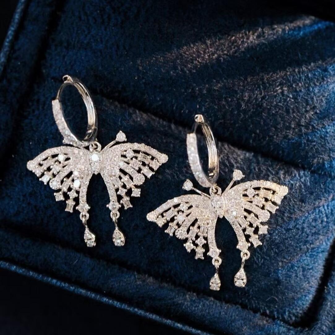14k Gold 1.36 Ct Natural H Diamond & Butterfly Earrings: Ref:231192009 // gold content:14k gold // main gemstone:diamond // shape:multiple // carat weight:1. 36ct // clarity grade:vs-si // color:h // treatment:natural // Condition: New Low Estimate: 3100.00