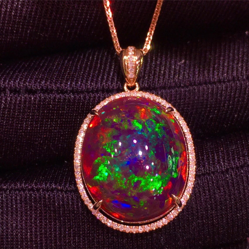 14k Gold 8.95 Ct Natural Opal & Diamond Pendant( Without Chain ): Ref:231192040 // gold content:14k gold // main gemstone:opal // shape:oval // carat weight:8. 95ct // color:color // treatment:natural // // adjacent gemstone 2 : diamond // shape:round // clarity gra