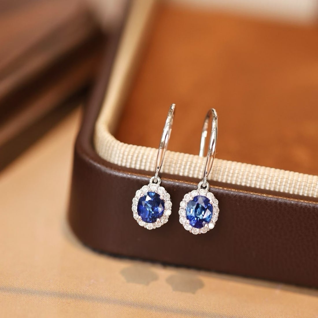 14k Gold 1.30 Ctw Natural Sapphire & Diamond Earrings: Ref:231192117 // gold content:14k gold // main gemstone:sapphire // shape:oval // carat weight:1. 08ct // color:blue // treatment:natural // // adjacent gemstone 2 : diamond // shape:round // carat
