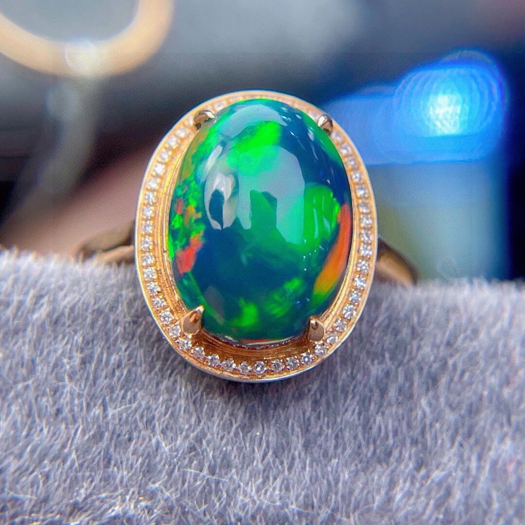 14k Gold 3.1 Ct Natural Opal & Diamond Ring: Ref:231192238 // gold content:14k gold // ring size:7. 25us // // main gemstone:opal // shape:oval // carat weight:3. 1ct // color:color // treatment:natural // // adjacent gemstone 2 : diamond // sha