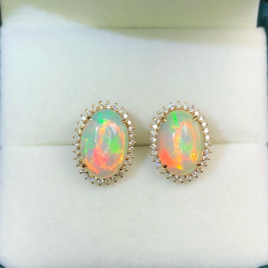 14k Gold 3.0 Ct Natural Opal & Diamond Earrings: Ref:231192317 // gold content:14k gold // main gemstone:opal // shape:oval // carat weight:3. 0ct // color:color // treatment:natural // // adjacent gemstone 2 : diamond // shape:round // clarity grad