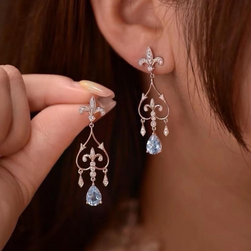 14k Gold 2.35 Ctw Natural Aquamarine & Diamond Earrings: Ref:231192437 // gold content:14k gold // main gemstone:aquamarine // shape:pear // carat weight:1. 90ct // color:blue // treatment:natural // // adjacent gemstone 2 : diamond // shape:round // carat 