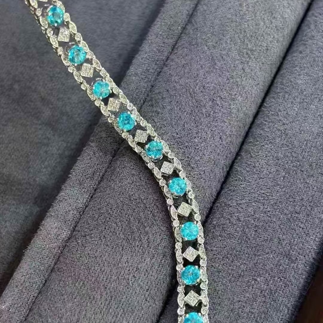 14k Gold 3.5 Ct Natural Paraiba Tourmaline & Diamond Bracelet: Ref:231063050 // gold content:14k gold // main gemstone:paraiba tourmaline // shape:round // carat weight:3. 5ct // color:blue // treatment:natural // cut grade:g // // adjacent gemstone 2 :