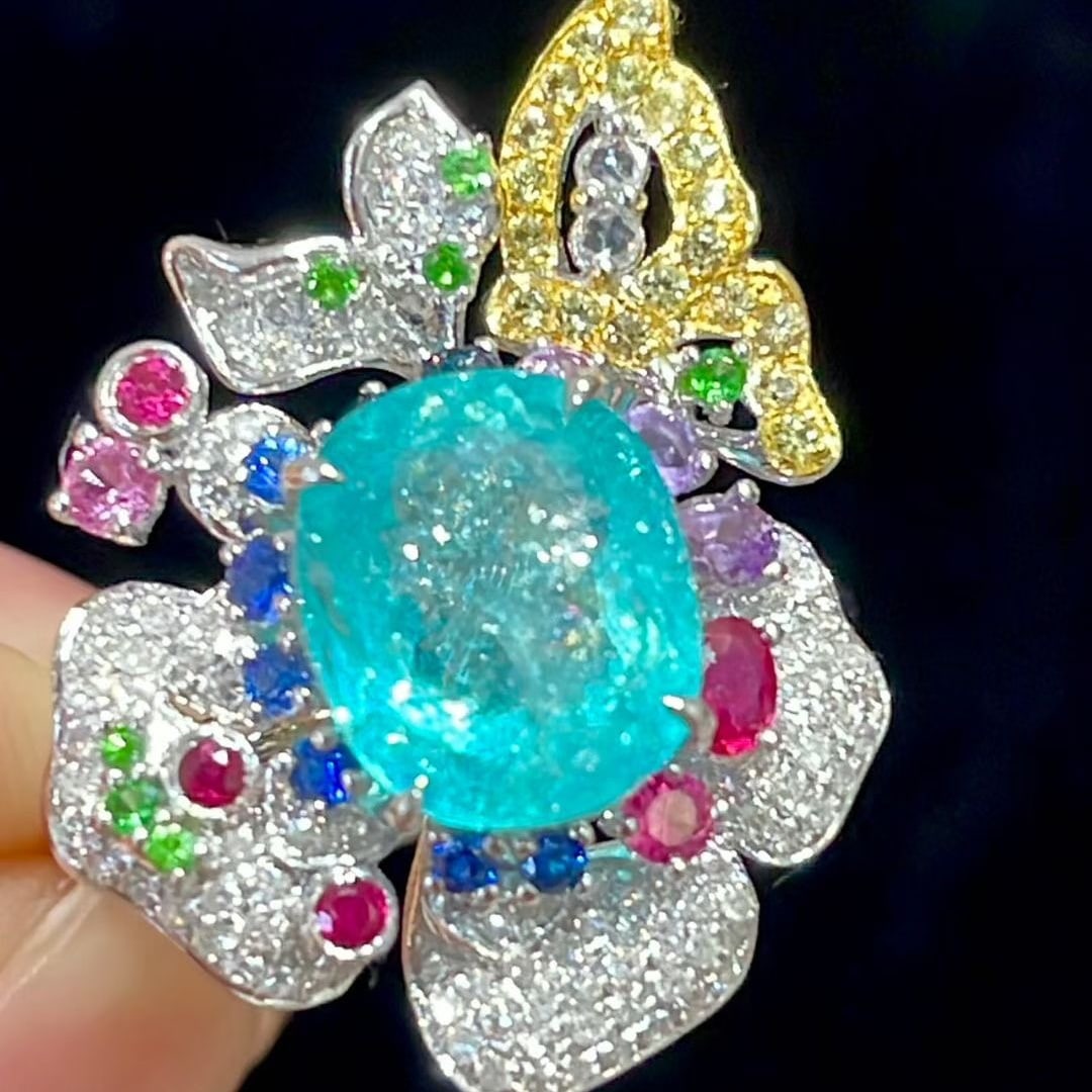 14k Gold 2.33 Ct Natural Paraiba Tourmaline & Diamond Ring: Ref:231063087 // gold content:14k gold // ring size:7. 25us // // main gemstone:paraiba tourmaline // shape:oval // carat weight:2. 33ct // color:blue // treatment:natural // // adjacent gemstone