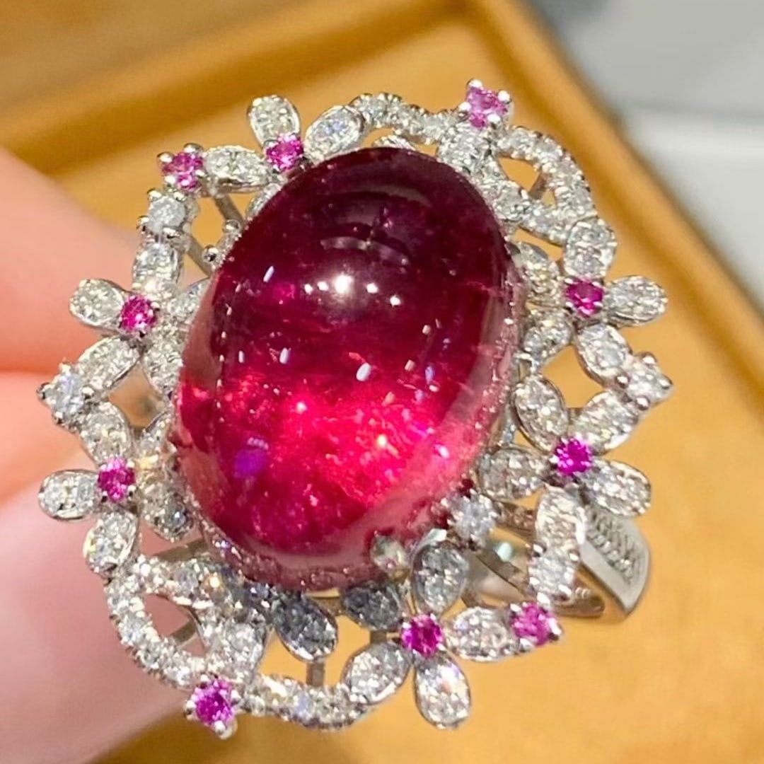 14k Gold 7.3 Ct Natural Tourmaline & Diamond Ring: Ref:231063093 // gold content:14k gold // ring size:7. 25us // // main gemstone:tourmaline // shape:oval // carat weight:7. 3ct // color:red // treatment:natural // // adjacent gemstone 2 : diamond //