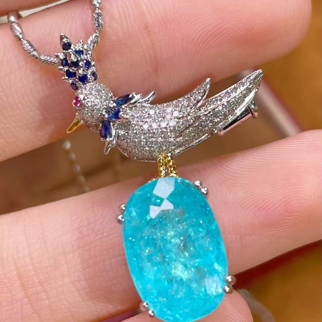 14k Gold 5.62 Ct Natural Paraiba Tourmaline & Diamond Brooch/pendant( Without Chain ): Ref:231063169 // gold content:14k gold // main gemstone:paraiba tourmaline // shape:oval // carat weight:5. 62ct // color:blue // treatment:natural // // adjacent gemstone 2 : diamond //