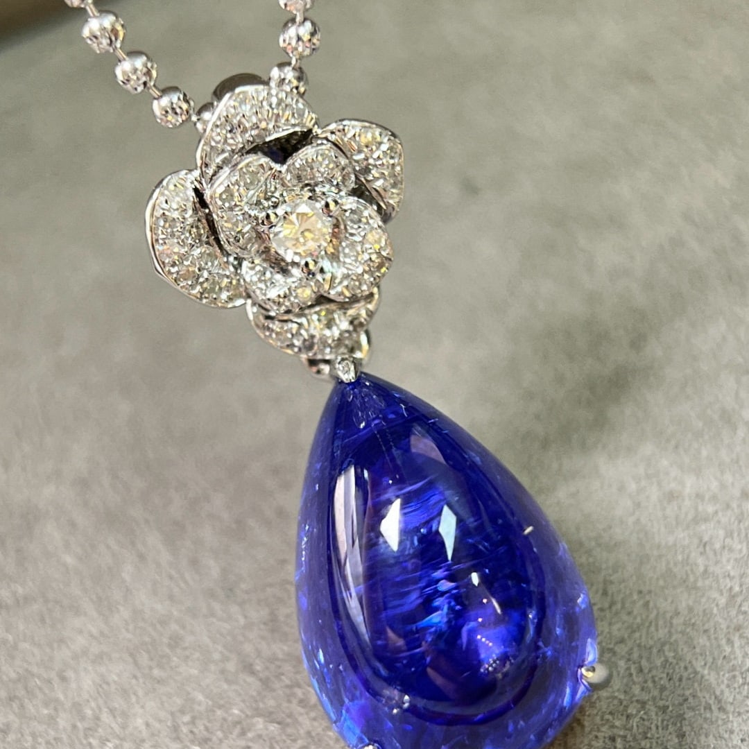 14k Gold 11.61 Ctw Natural Tanzanite & Diamond Pendant( Without Chain ): Ref:231063176 // gold content:14k gold // main gemstone:tanzanite // shape:pear // carat weight:11. 45ct // color:blue // treatment:natural // // adjacent gemstone 2 : diamond // shape:round //
