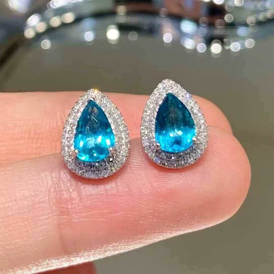 14k Gold 1.45 Ct Natural Paraiba Tourmaline & Diamond Earrings: Ref:231063210 // gold content:14k gold // main gemstone:paraiba tourmaline // shape:pear // carat weight:1. 45ct // color:blue // treatment:natural // // adjacent gemstone 2 : diamond //