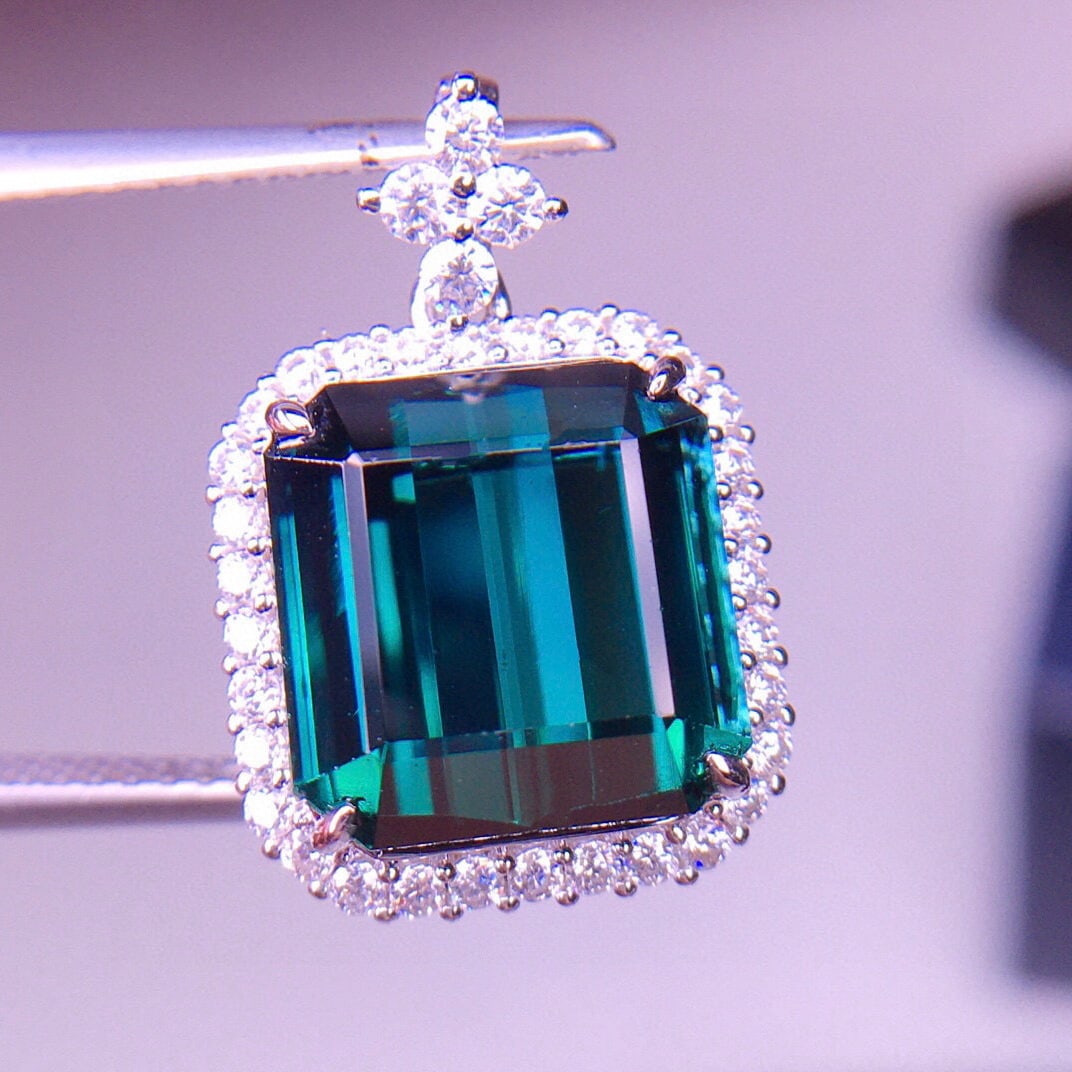 14k Gold 7.1 Ct Natural Tourmaline & Diamond Pendant( Without Chain ): Ref:231063248 // gold content:14k gold // main gemstone:tourmaline // shape:octagonal // carat weight:7. 1ct // color:blue // treatment:natural // // adjacent gemstone 2 : diamond // shape:round // cl