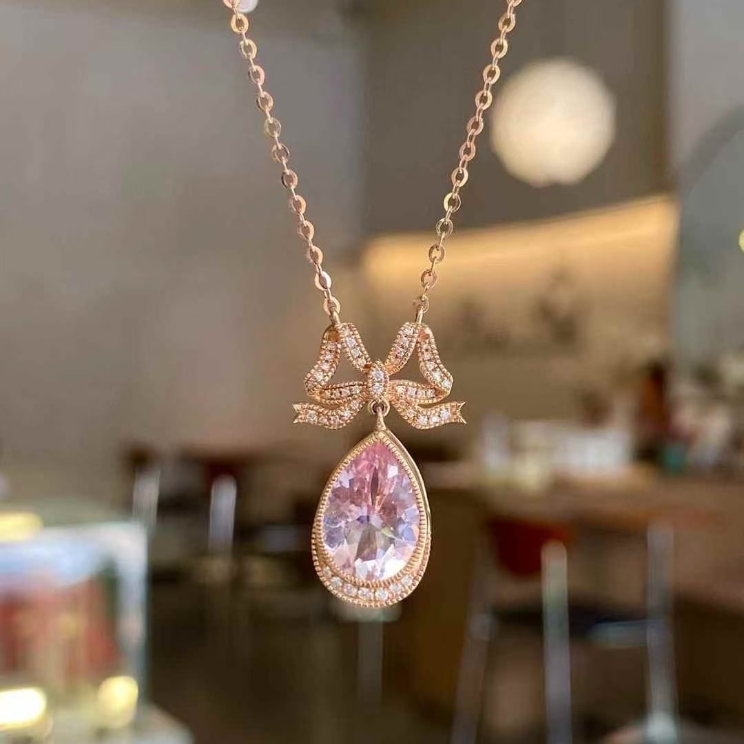 14k Gold 2.49 Ctw Natural Morganite & Diamond Necklace: Ref:231063249 // gold content:14k gold // main gemstone:morganite // shape:pear // carat weight:2. 33ct // color:pink // treatment:natural // // adjacent gemstone 2 : diamond // shape:round //