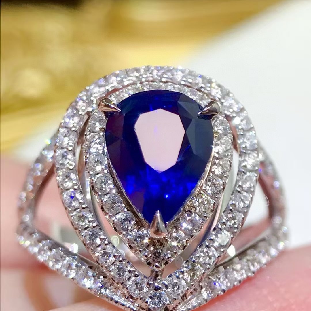 14k Gold 3.25 Ctw Natural Sapphire & Diamond Ring: Ref:231064360 // gold content:14k gold // ring size:7. 25us // // main gemstone:sapphire // shape:pear // carat weight:2. 5ct // color:royal blue // treatment:natural // // adjacent gemstone 2 :