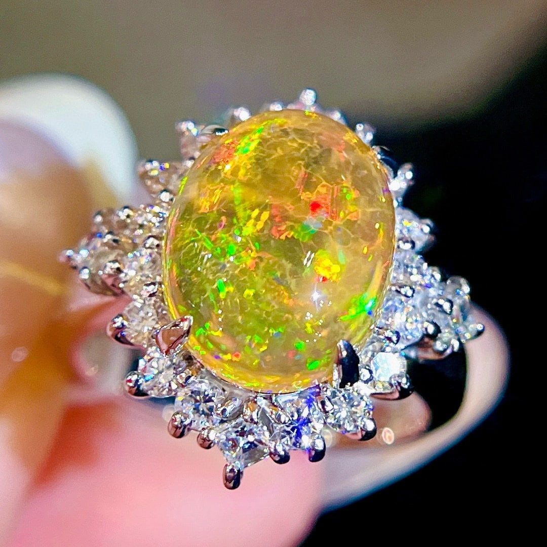 14k Gold 3.83 Ctw Natural Opal & Diamond Ring: Ref:231064374 // gold content:14k gold // ring size:7. 25us // // main gemstone:opal // shape:oval // carat weight:3. 15ct // color:color // treatment:natural // // adjacent gemstone 2 : diamond