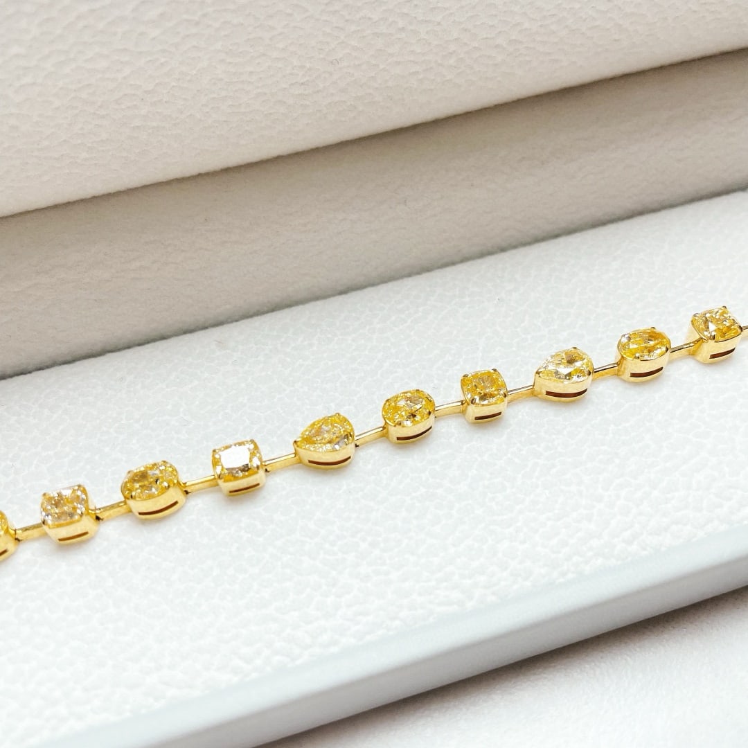 14k Gold 7.43 Ct Natural Yellow Diamond Bracelet: Ref:231064425 // gold content:14k gold // main gemstone:yellow diamond // shape:multiply // carat weight:7. 43ct // color:yellow // treatment:natural // High Estimate: 33000Condition: NewLow