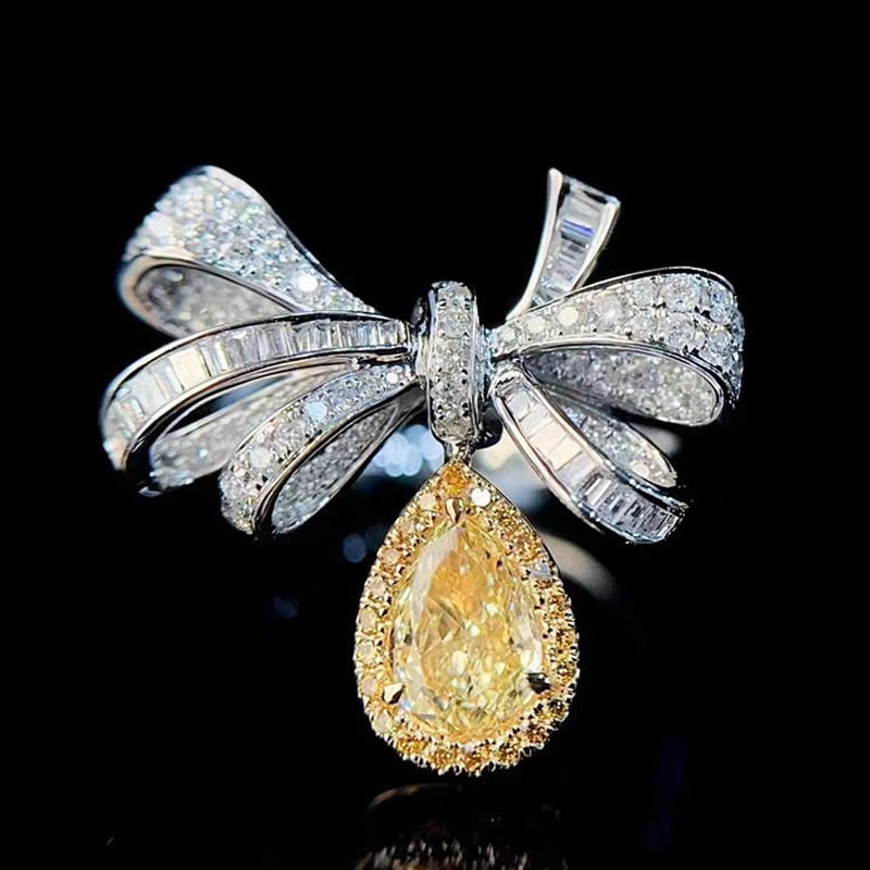 14k Gold 1.13 Ctw Natural Yellow Diamond & Diamond Ring: Ref:231065112 // gold content:14k gold // ring size:7. 25us // // main gemstone:yellow diamond // shape:pear // carat weight:0. 63ct // color:yellow // treatment:natural // // adjacent gemstone 2