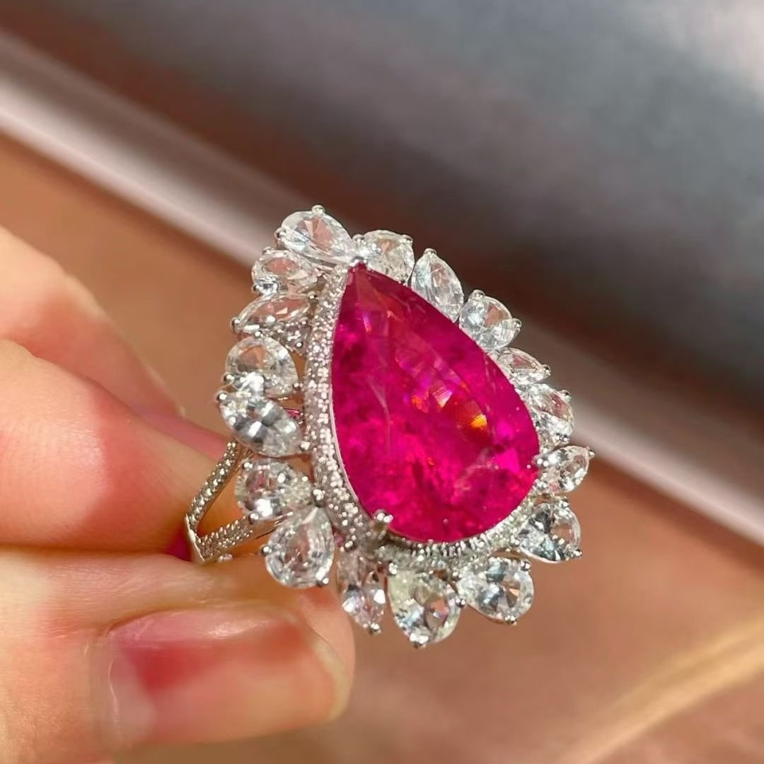 14k Gold 7.69 Ctw Natural Tourmaline & Sapphire Ring: Ref:231065168 // gold content:14k gold // ring size:7. 25us // // main gemstone:tourmaline // shape:pear // carat weight:5. 19ct // color:red // treatment:natural // // adjacent gemstone 2 : sapphire