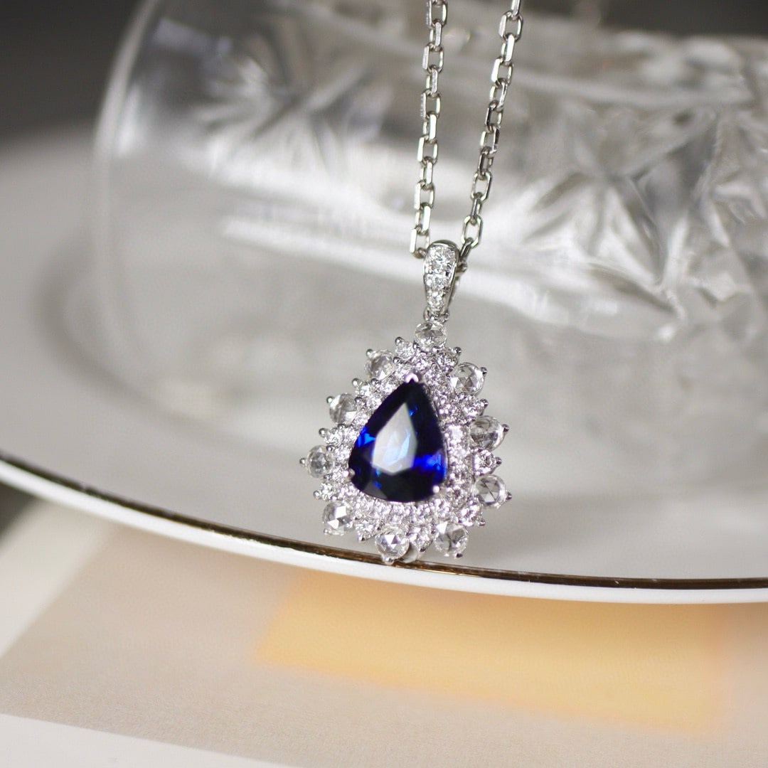 14k Gold 3.37 Ctw Natural Sapphire & Diamond Pendant( Without Chain ): Ref:231066062 // gold content:14k gold // main gemstone:sapphire // shape:pear // carat weight:2. 40ct // color:royal blue // treatment:natural // // adjacent gemstone 2 : diamond // shape:round //