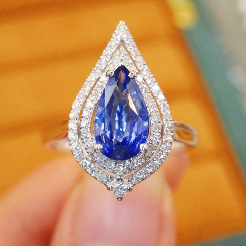 14k Gold 1.96 Ctw Natural Sapphire & Diamond Ring: Ref:231066106 // gold content:14k gold // ring size:7. 25us // // main gemstone:sapphire // shape:pear // carat weight:1. 63ct // color:blue // treatment:natural // // adjacent gemstone 2 :