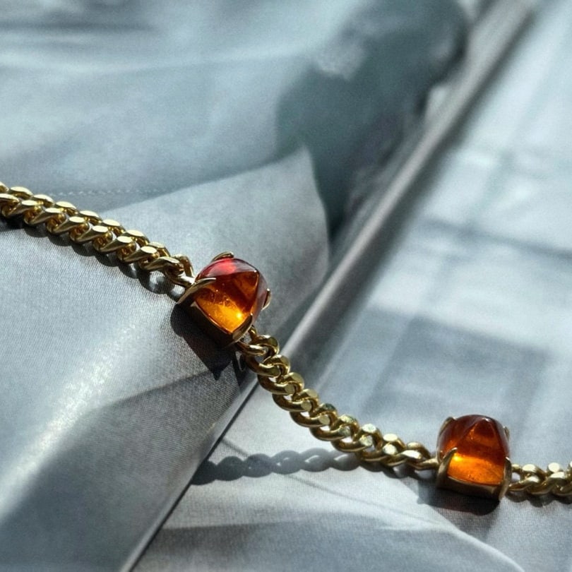 14k Gold 4.5 Ct Natural Spessartine Bracelet: Ref:231066210 // gold content:14k gold // main gemstone:spessartine // shape:sugar-loaf // carat weight:4. 5ct // color:orange // treatment:natural // Condition: NewLow Estimate: 4000.00High