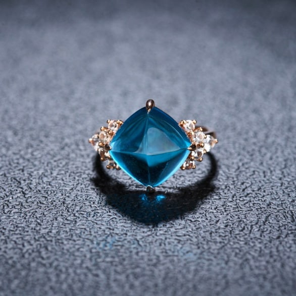 14k Gold 9.58 Ctw Natural Topaz & Sapphire Ring: Ref:231066233 // gold content:14k gold // ring size:7. 25us // // main gemstone:topaz // shape:sugar-loaf // carat weight:8. 95ct // color:blue // treatment:natural // // adjacent gemstone 2 :