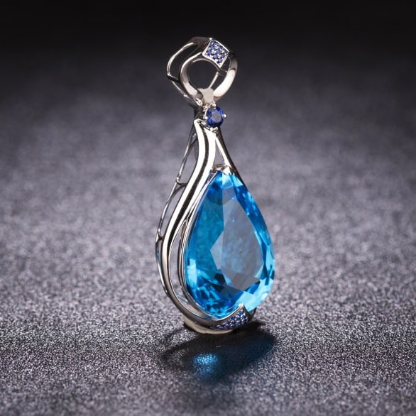 14k Gold 24.41 Ctw Natural Topaz & Sapphire Pendant( Without Chain ): Ref:231066252 // gold content:14k gold // main gemstone:topaz // shape:pear // carat weight:24. 26ct // color:blue // treatment:natural // // adjacent gemstone 2 : sapphire // shape:round // carat wei