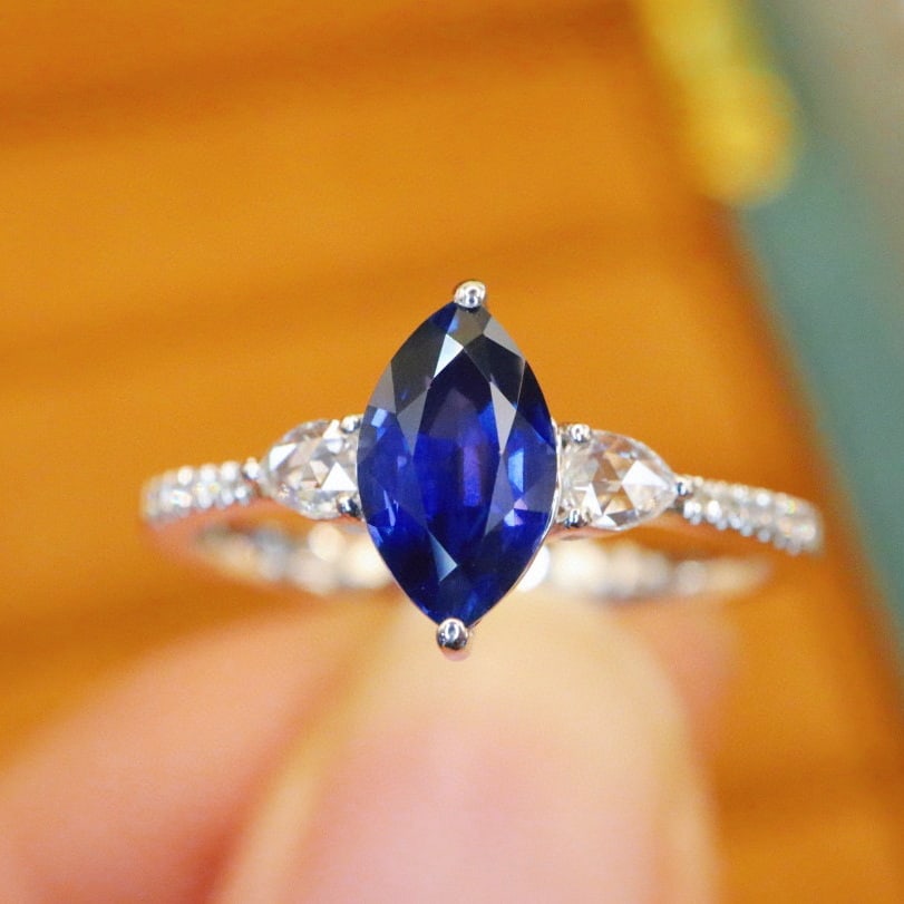 14k Gold 1.26 Ctw Natural Sapphire & Diamond Ring: Ref:231066334 // gold content:14k gold // ring size:7. 25us // // main gemstone:sapphire // shape:marquise // carat weight:1. 15ct // color:royal blue // treatment:natural // // adjacent gemstone 2 :