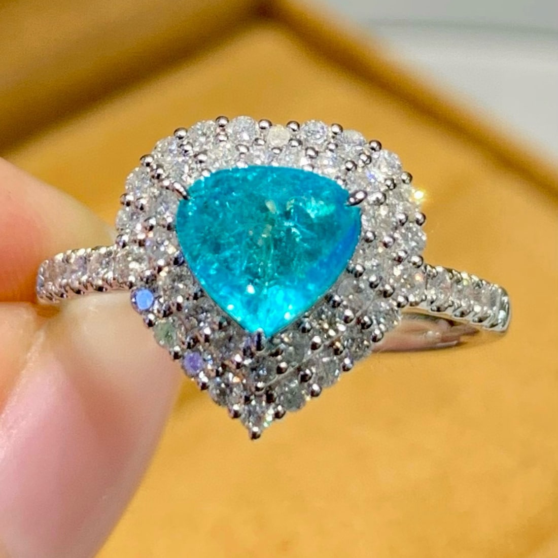 14k Gold 0.9 Ct Natural Paraiba Tourmaline & Diamond Ring: Ref:231123055 // gold content:14k gold // ring size:7. 25us // // main gemstone:paraiba tourmaline // shape:pear // carat weight:0. 9ct // color:blue // treatment:natural // // adjacent gemstone 2