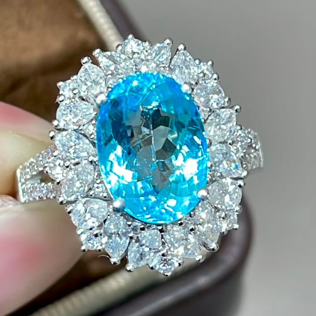 14k Gold 4.85 Ctw Natural Paraiba Tourmaline & Diamond Ring: Ref:231123193 // gold content:14k gold // ring size:7. 25us // // main gemstone:paraiba tourmaline // shape:oval // carat weight:3. 55ct // color:blue // treatment:natural // // adjacent gemstone 2 :