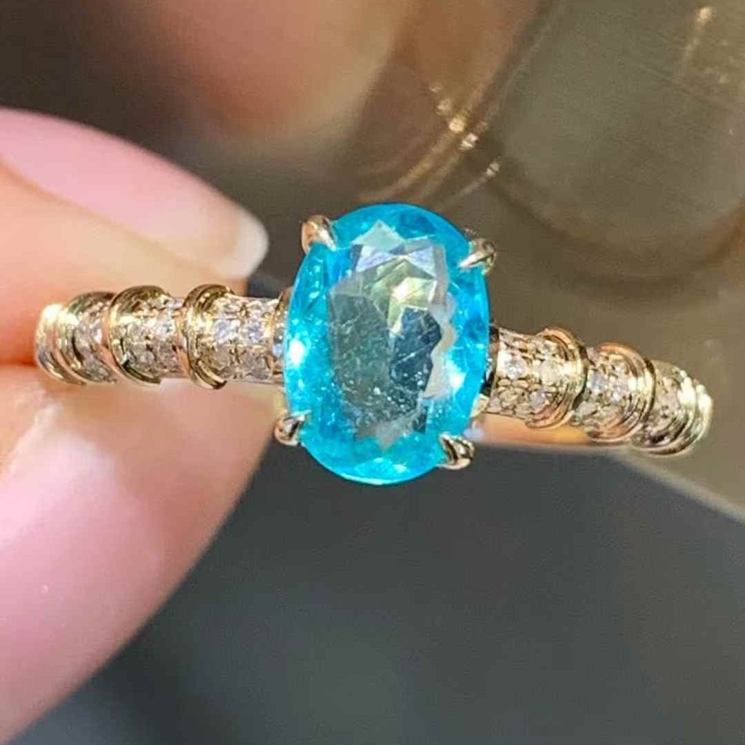 14k Gold 0.95 Ct Natural Paraiba Tourmaline & Diamond Ring: Ref:231123235 // gold content:14k gold // ring size:7. 25us // // main gemstone:paraiba tourmaline // shape:oval // carat weight:0. 95ct // color:blue // treatment:natural // // adjacent gemstone