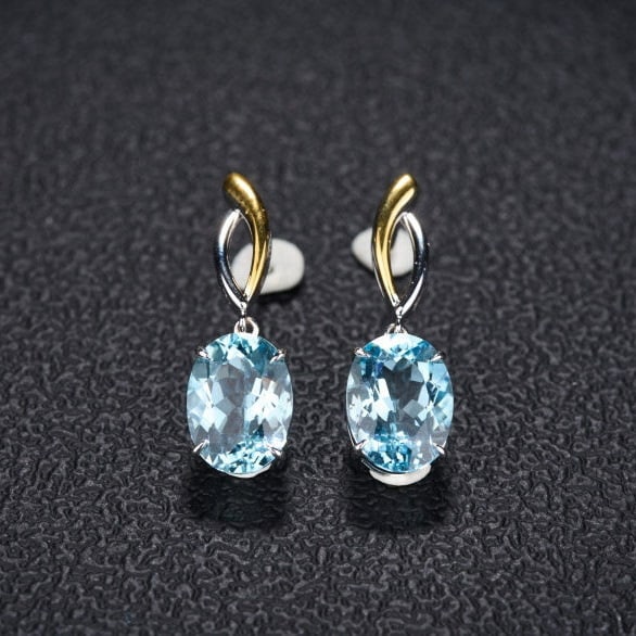 14k Gold 5.8 Ct Natural Aquamarine Earrings: Ref:231124016 // gold content:14k gold // main gemstone:aquamarine // shape:oval // carat weight:5. 8ct // color:santa maria color // treatment:natural // Condition: NewLow Estimate: 4300.00High