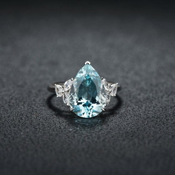 14k Gold 4.71 Ctw Natural Aquamarine & Sapphire Ring: Ref:231124058 // gold content:14k gold // ring size:7. 25us // // main gemstone:aquamarine // shape:pear // carat weight:4. 27ct // color:santa maria color // treatment:natural // // adjacent