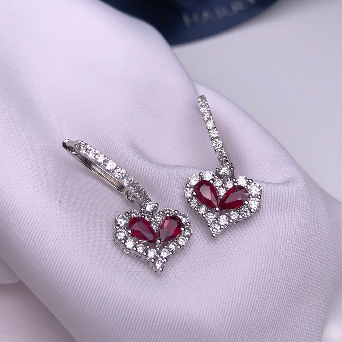 14k Gold 2.31 Ctw Natural Ruby & Diamond Earrings: Ref:231124420 // gold content:14k gold // main gemstone:ruby // shape:pear // carat weight:1. 22ct // color:pigeonblood red // treatment:natural // // adjacent gemstone 2 : diamond // shape:round