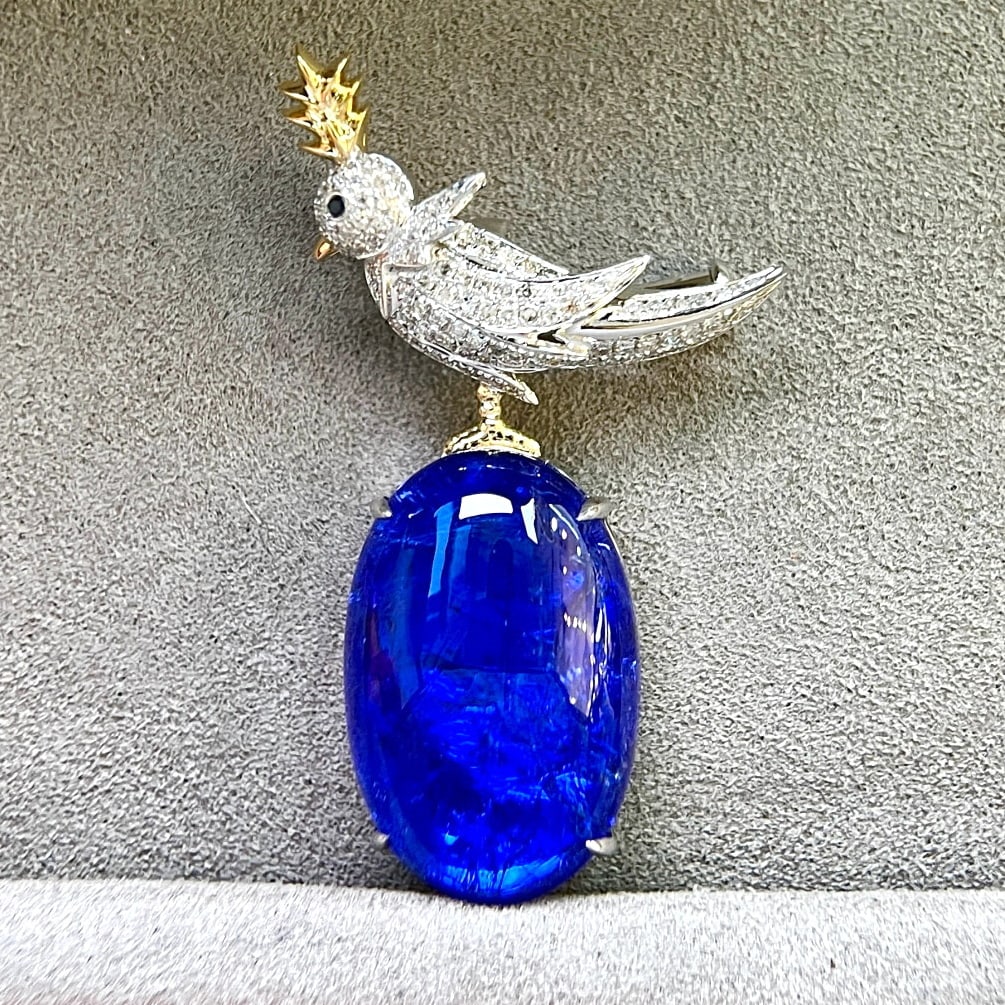 14k Gold 17.89 Ctw Natural Tanzanite & Diamond Brooch/pendant( Without Chain ): Ref:231067015 // gold content:14k gold // main gemstone:tanzanite // shape:oval // carat weight:17. 45ct // color:blue // treatment:natural // // adjacent gemstone 2 : diamond // shape:round //