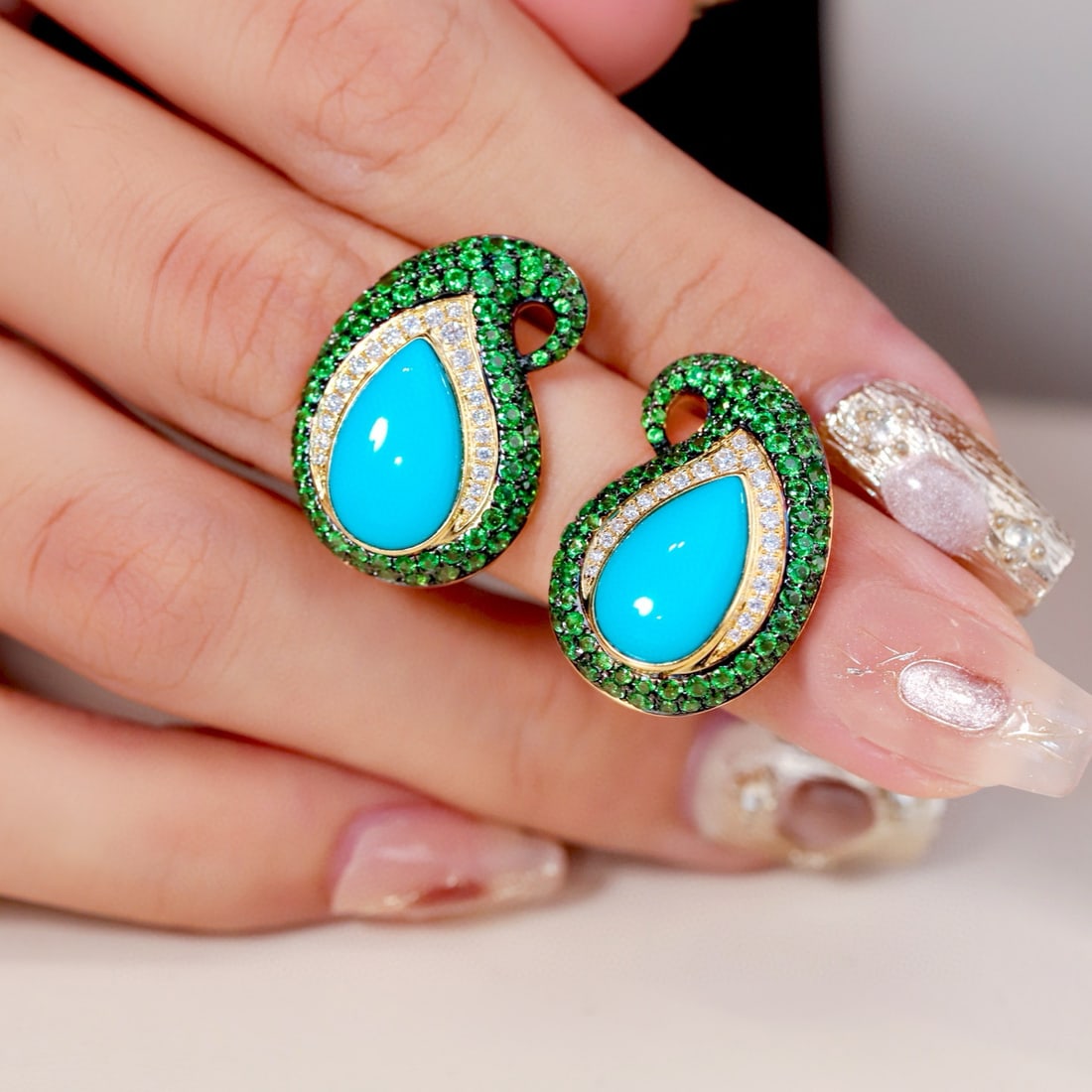 14k Gold 7.70 Ctw Natural Turquoise & Tsavorite Earrings: Ref:231067017 // gold content:14k gold // main gemstone:turquoise // shape:pear // carat weight:5. 28ct // color:blue // treatment:natural // // adjacent gemstone 2 : tsavorite // shape:round //