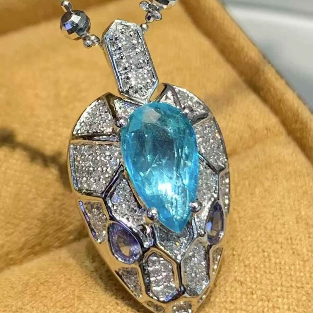 14k Gold 1 Ct Natural Paraiba Tourmaline & Diamond Pendant( Without Chain ): Ref:231067056 // gold content:14k gold // main gemstone:paraiba tourmaline // shape:pear // carat weight:1ct // color:blue // treatment:natural // // adjacent gemstone 2 : diamond // shape:round //