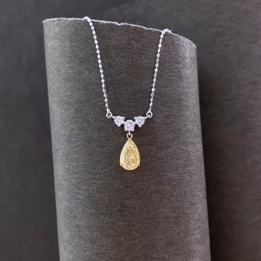 14k Gold 0.89 Ctw Natural Yellow Diamond & Diamond Necklace: Ref:231067151 // gold content:14k gold // main gemstone:yellow diamond // shape:pear // carat weight:0. 71ct // color:yellow // treatment:natural // // adjacent gemstone 2 : diamond // shape:round